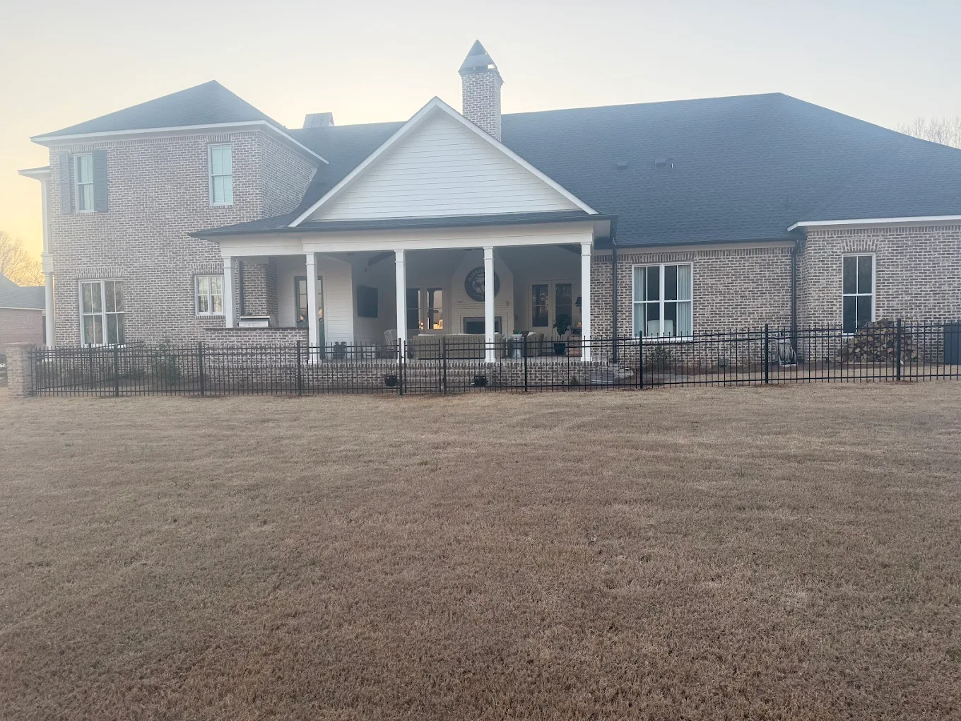 Metal gate installation with arched top - driveway gate repair and installation in Starkville, MS